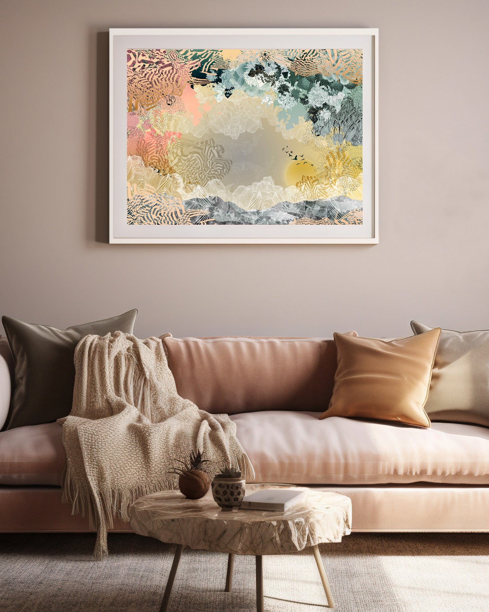 A mock up of a Giclee print in a white frame in front of a pink sofa