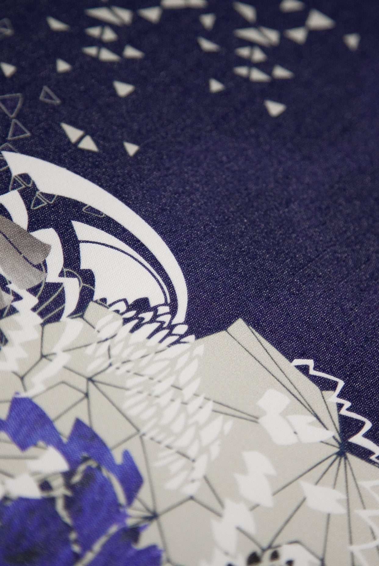 A close up of a mural wallpaper showing the linen texture