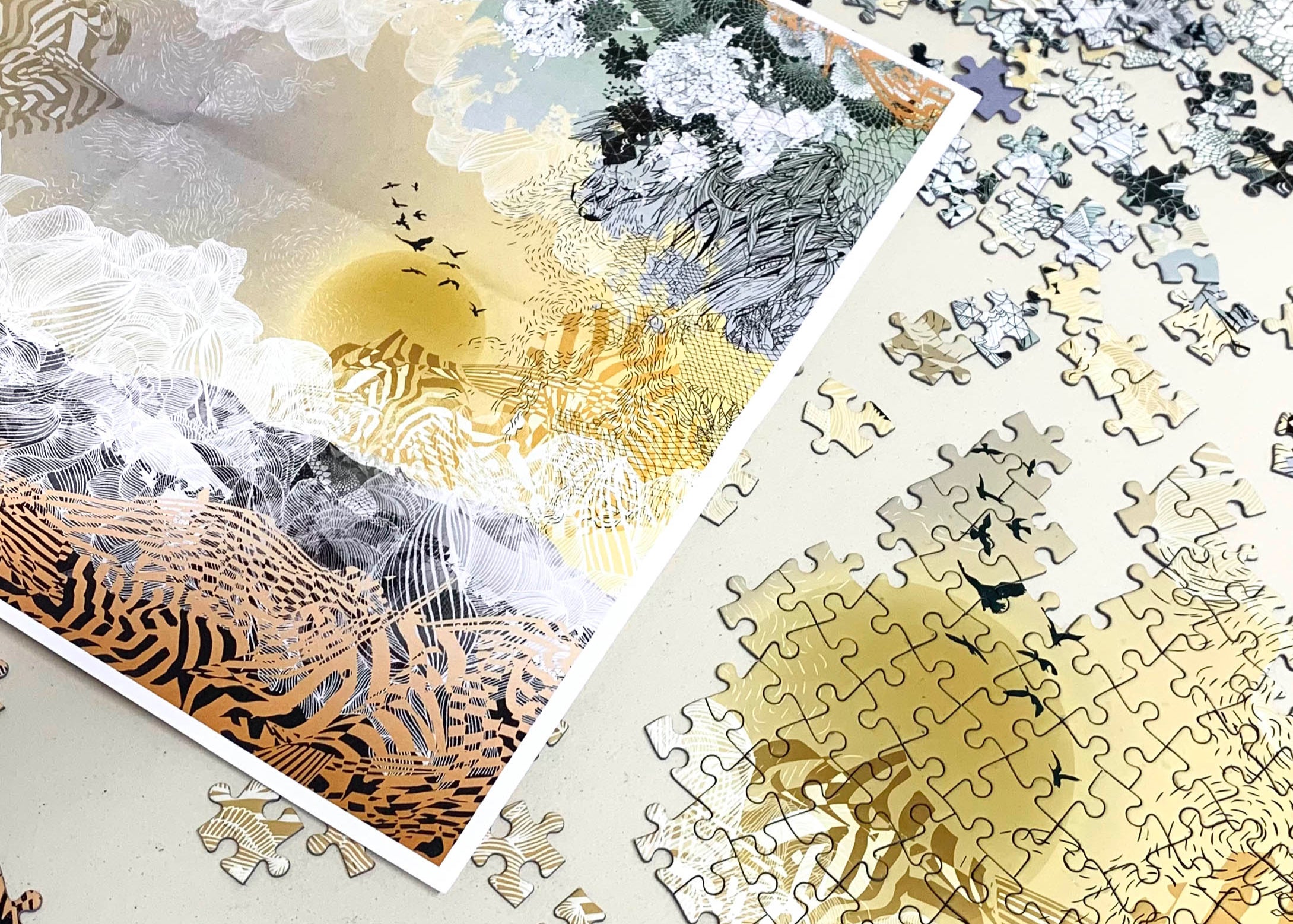 A printed jigsaw box of a yellow and orange landscape