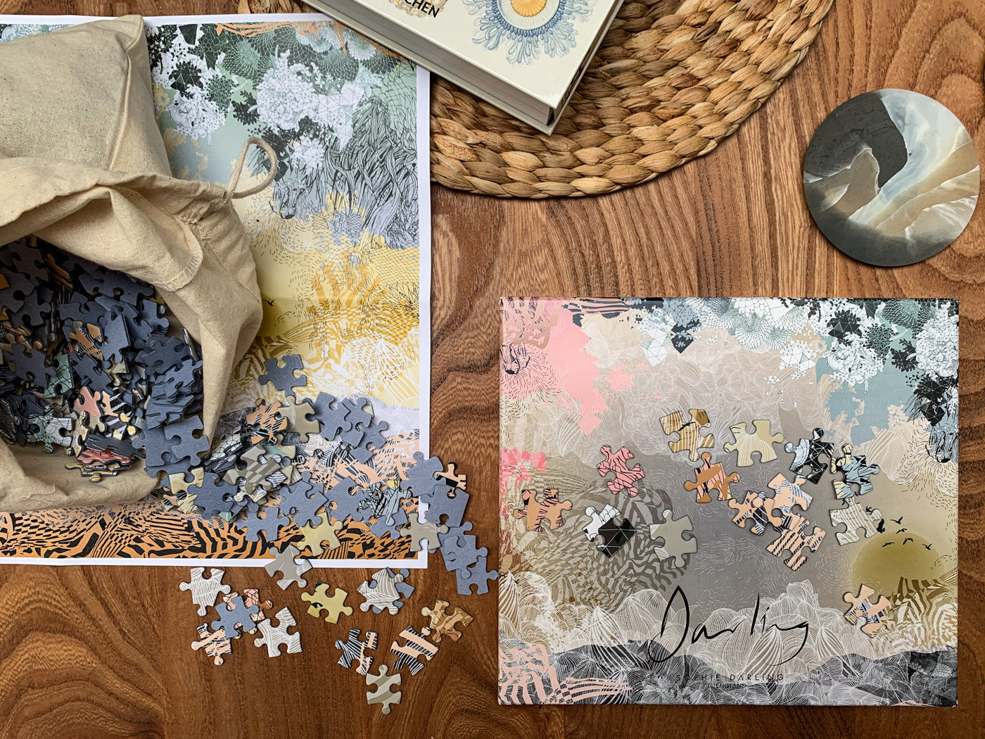 A printed jigsaw and jigsaw box of a yellow and orange landscape