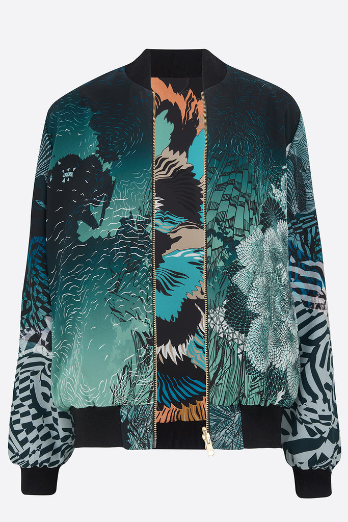 An open reversible silk bomber jacket with blues on one side and a floral print on the other