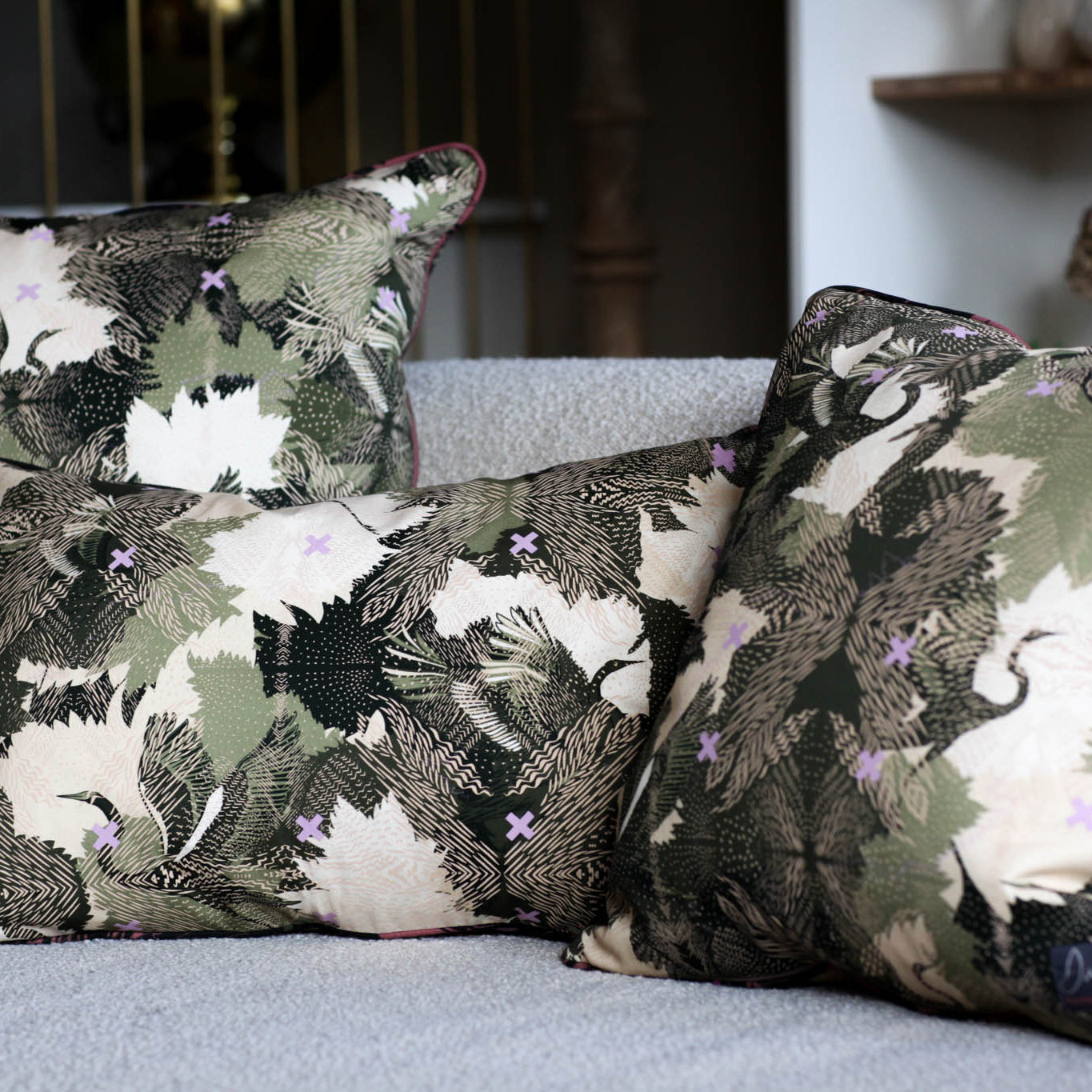 Hand printed cushions of different sizes on a white sofa