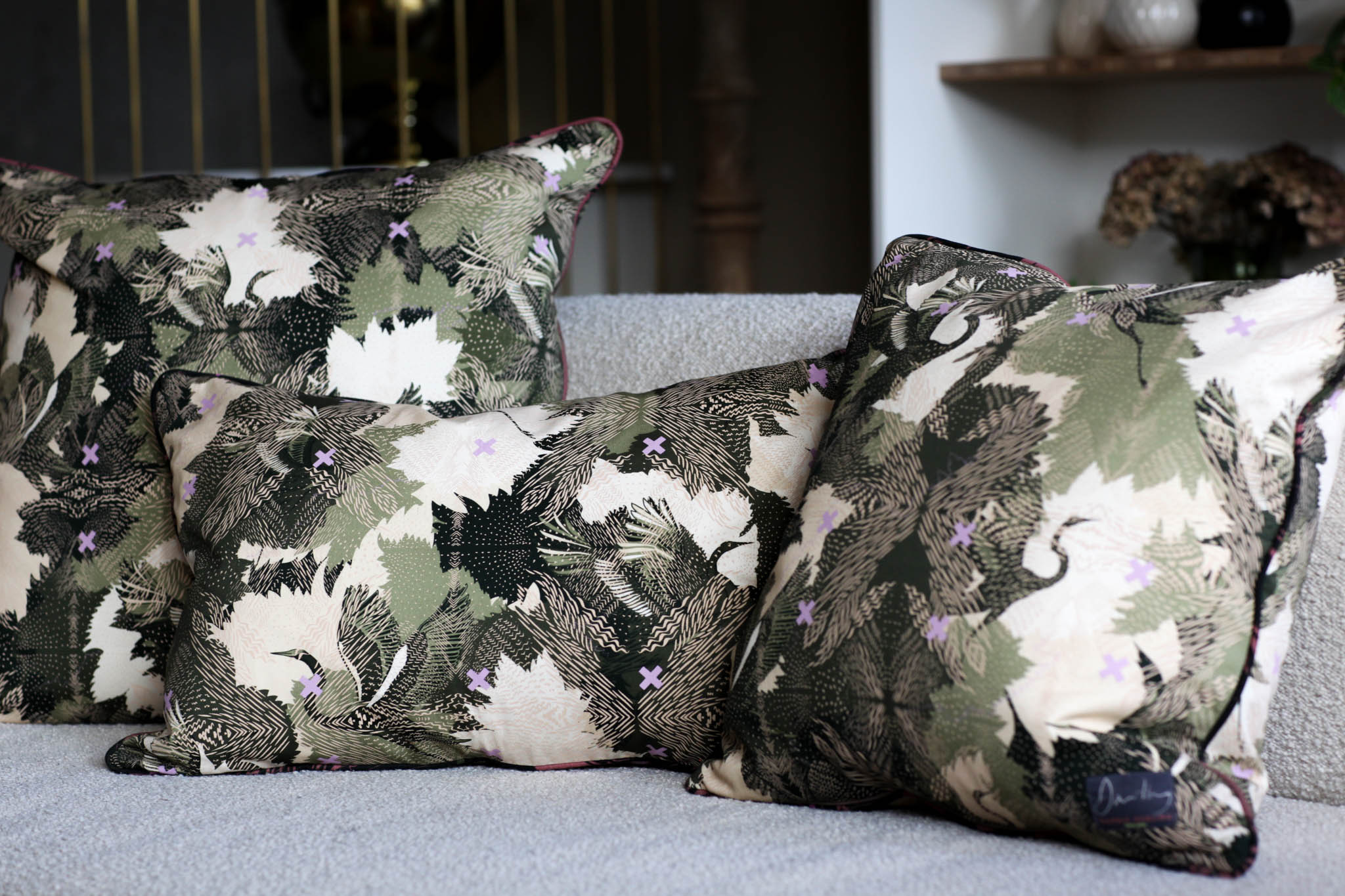 Hand printed cushions of different sizes on a white sofa