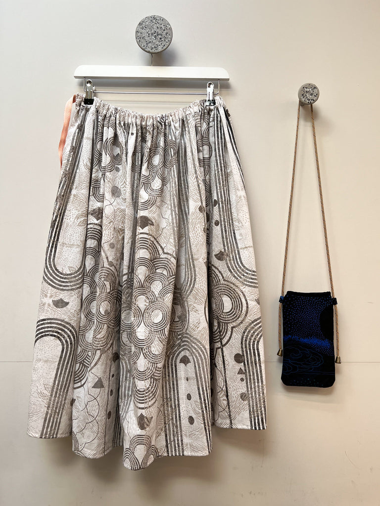 An organic cotton hand printed midi skirt in white and grey