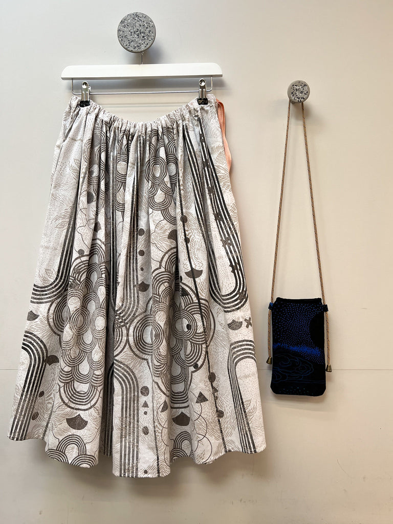 An organic cotton hand printed midi skirt in white and grey