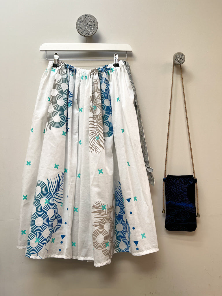 An organic cotton hand printed midi skirt in white, blue and grey