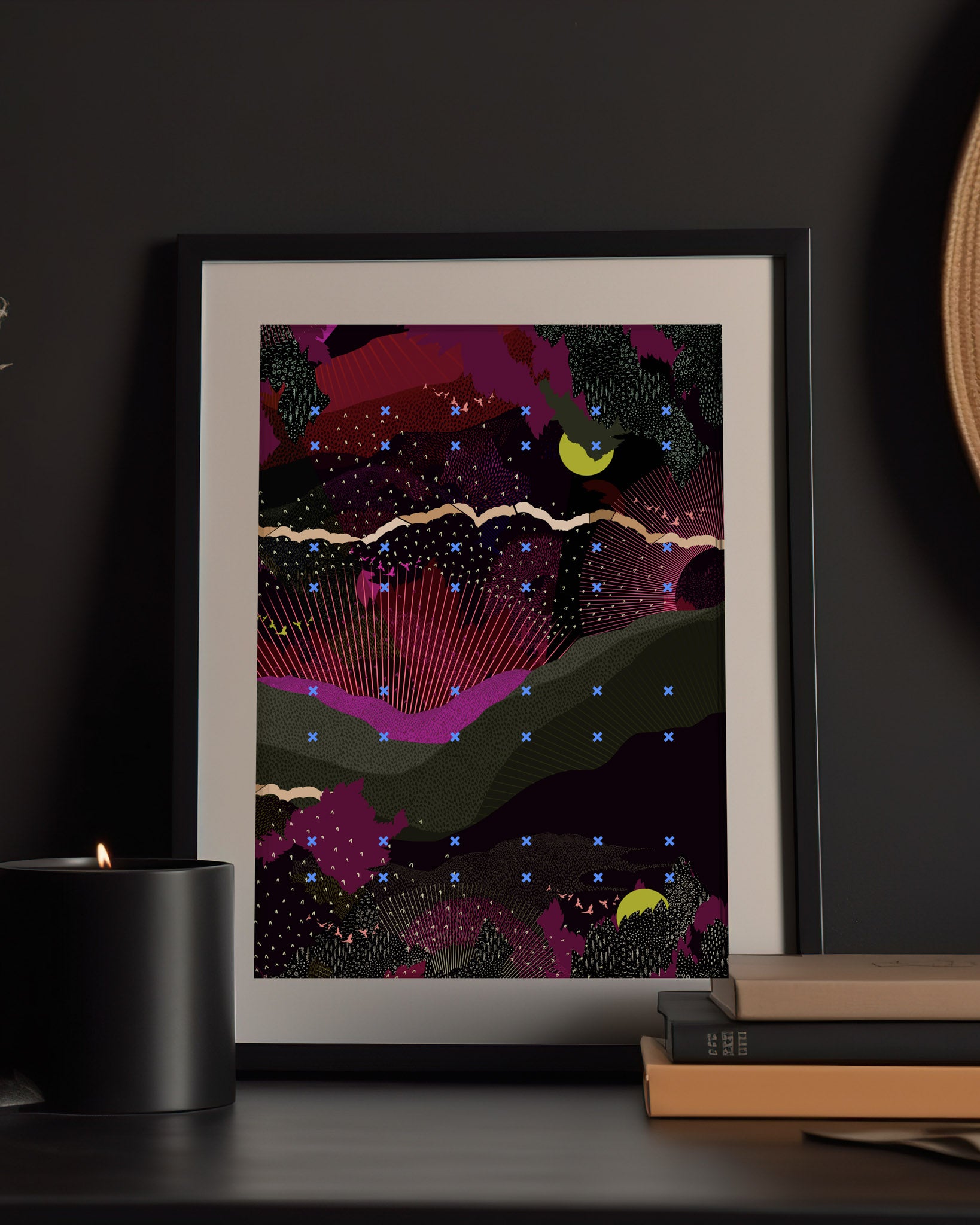 A mock up of a giclee print with landscape design in greens and pinks with lime green moon details