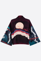 The back of a silk cropped kimono jacket