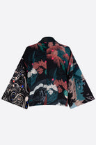 The front of a silk cropped kimono jacket