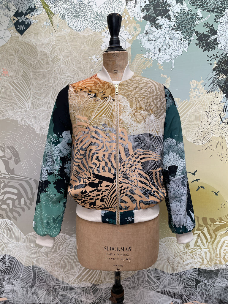 A silk printed bomber jacket in both dark and light prints 