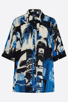 Hand printed silk shirt with blue and white abstract print on black background 