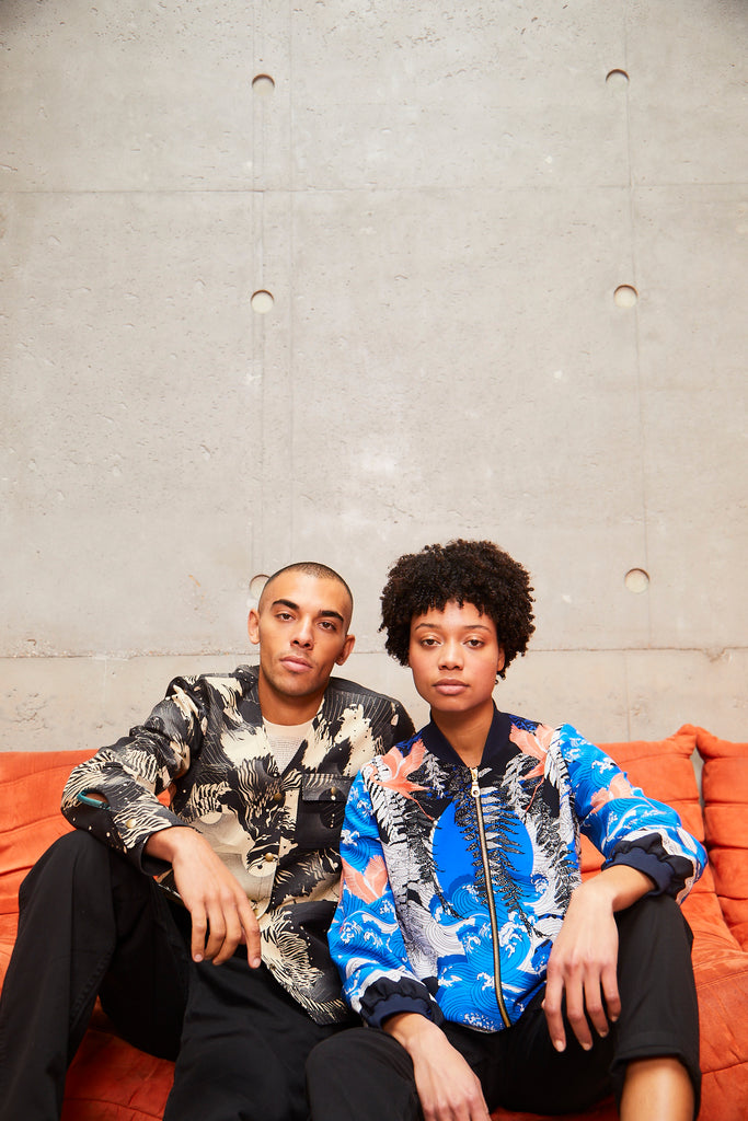 couple wearing silk bomber jackets