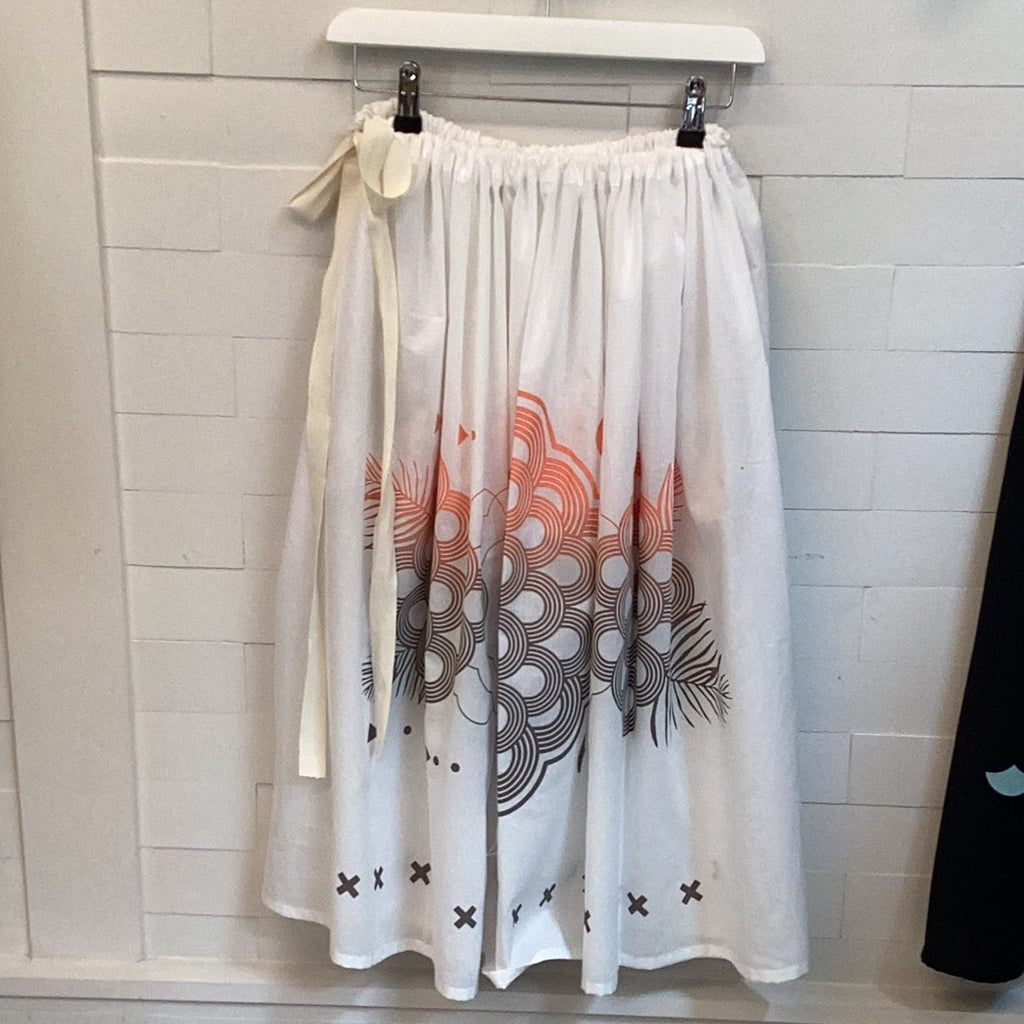 An organic cotton handprinted midi skirt in white, peach and grey
