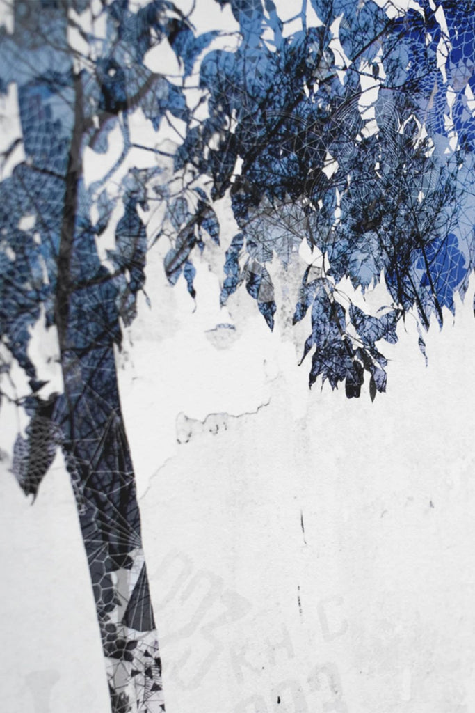 A close up of a giclee layered tree print in blue and white