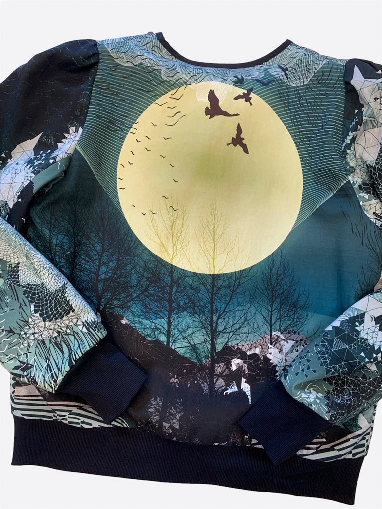 Back of a cotton jacket with a large yellow moon, birds and a blue landscapes design