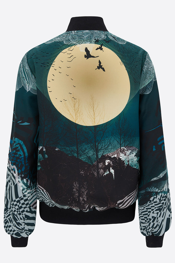 The back of a silk bomber jacket in blues and yellows with a large moon and landscape