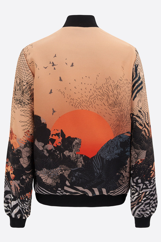 The back of a silk printed bomber jacket with a yellow and orange landscape