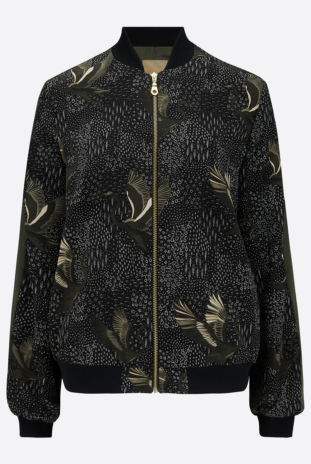 The front of a printed silk bomber in green and black