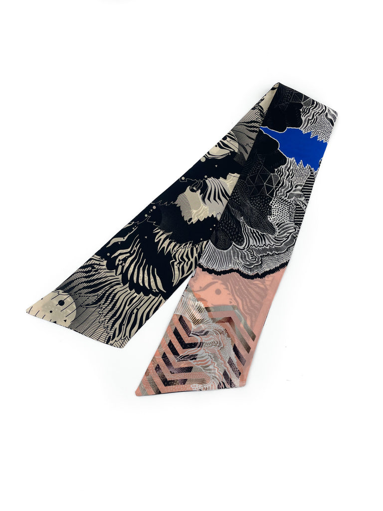 A silk printed headscarf in black, blue, pink and white
