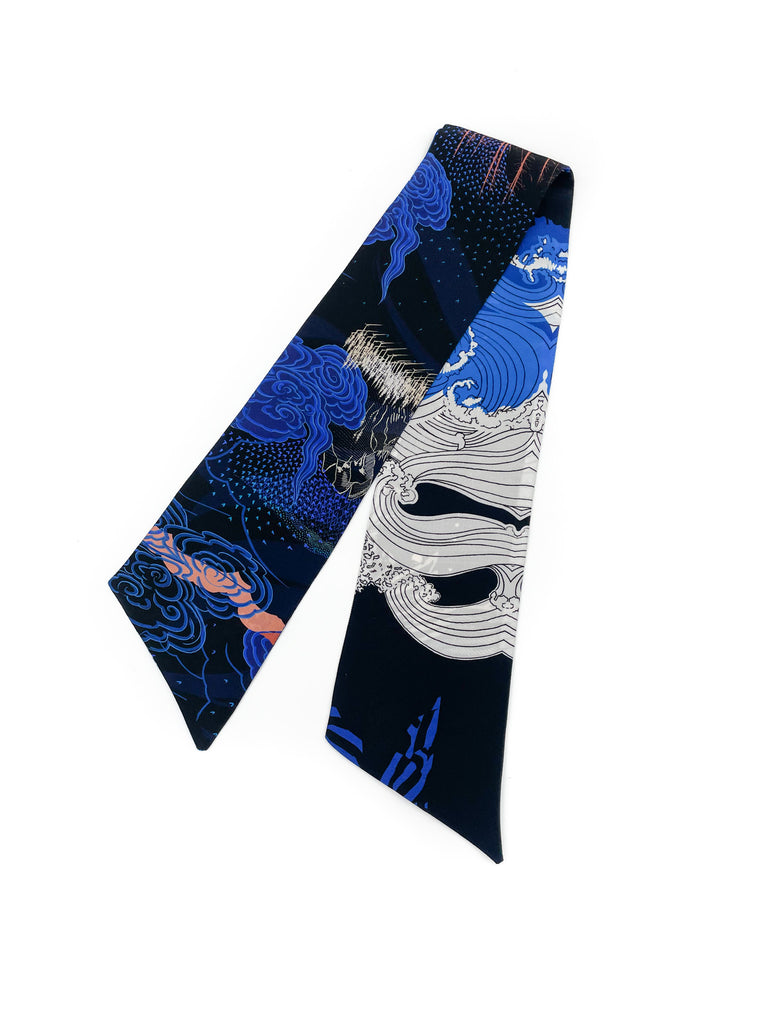 A silk printed headscarf in blue, black and white