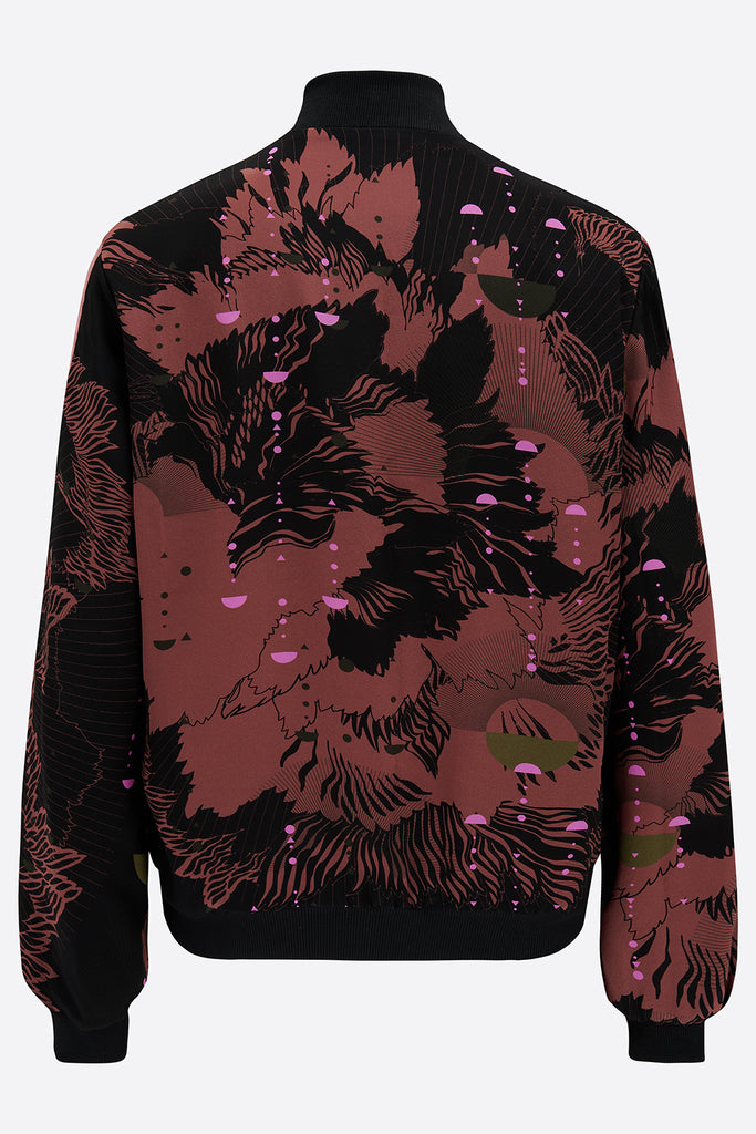 The back of a silk printed bomber jacket in black and pink