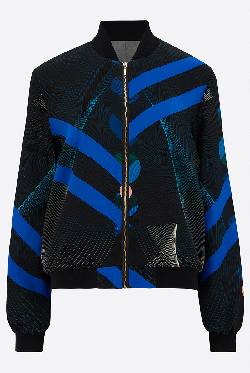Front of a Silk Bomber Jacket with bold blue stripes against a geometric print background