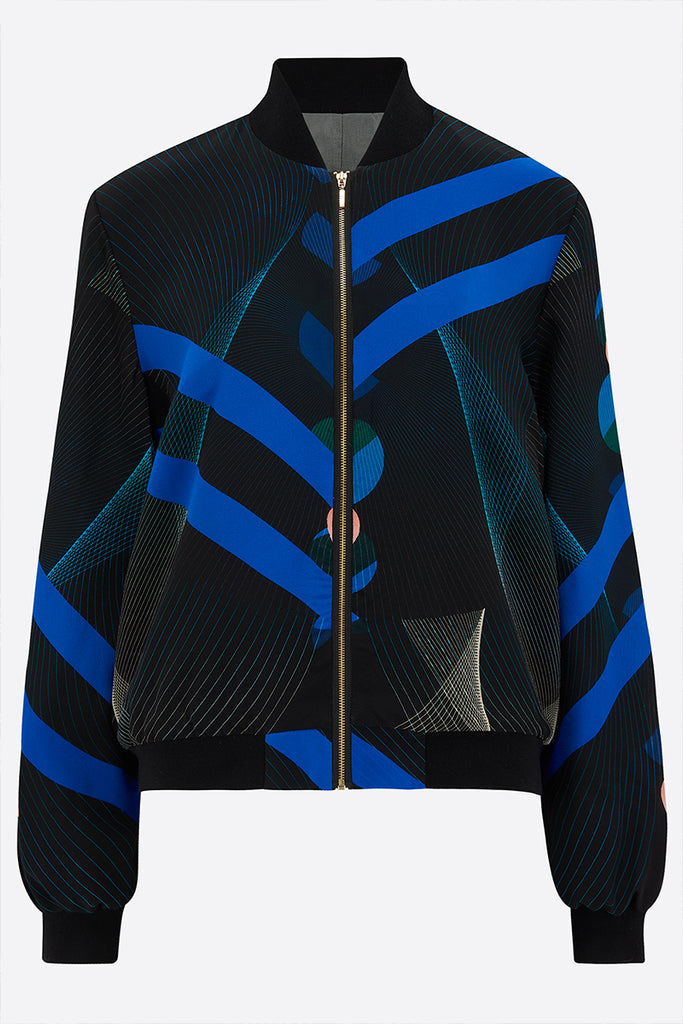 Front of a Silk Bomber Jacket with bold blue stripes against a geometric print background