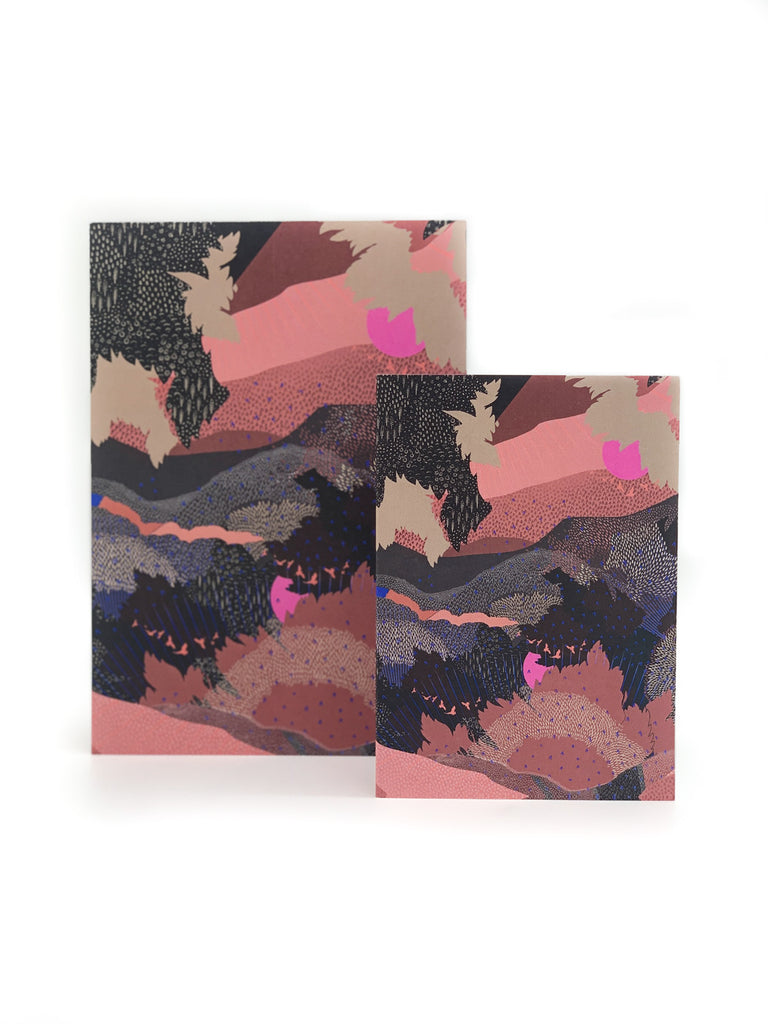 A printed greeting card in pink and black