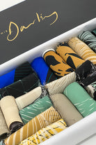 A ribbon box containing blue tone fabric pieces 