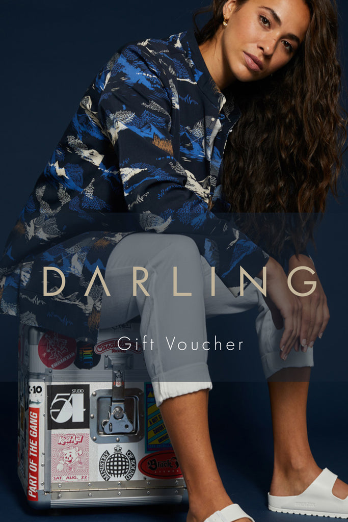 A woman in a blue jacket printed onto a Sophie Darling gift voucher.