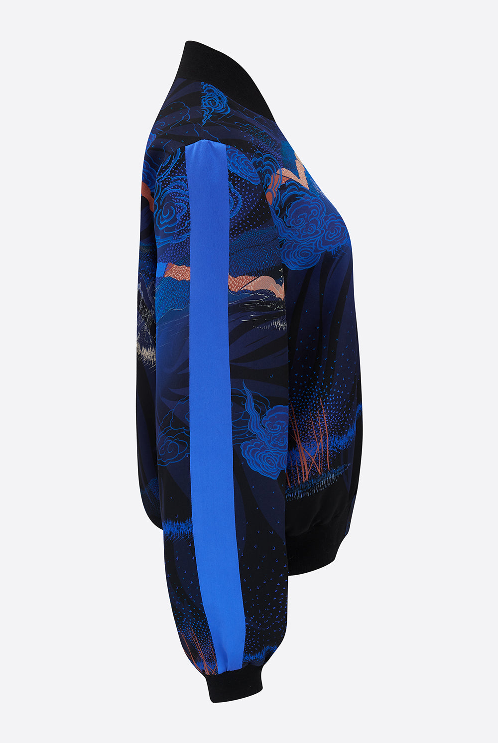 Side of a Silk Bomber jacket with a Japanese landscape in blues and pinks and blue stripe on arm
