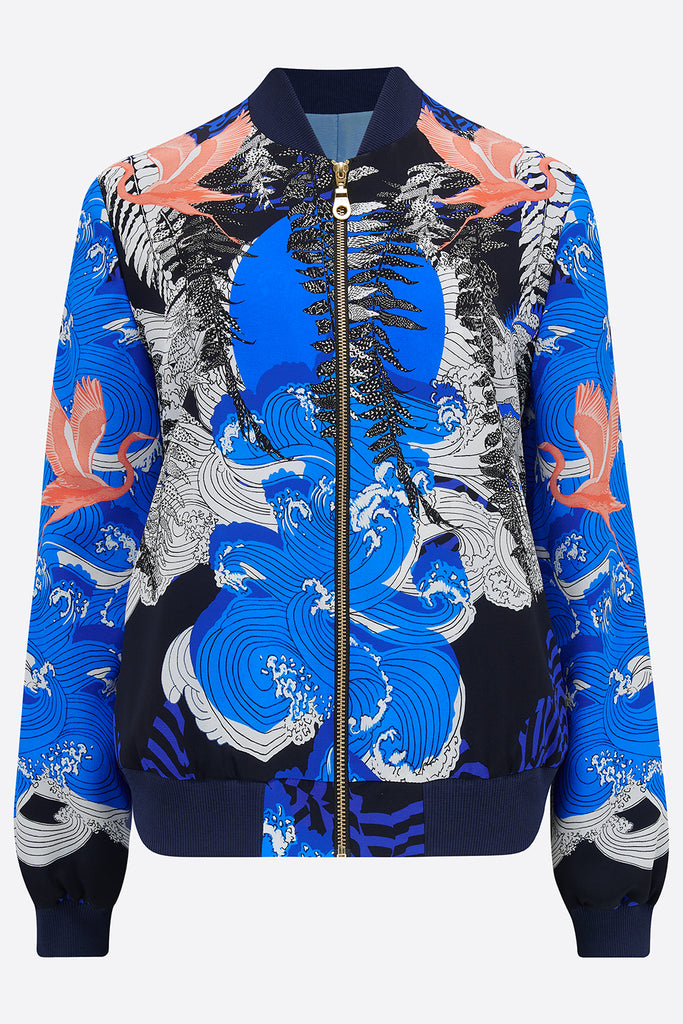 Front of silk bomber jacket in blue, white and coral with waves and birds design