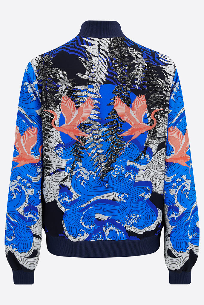 Back of silk bomber jacket in blue, white and coral with waves and birds design