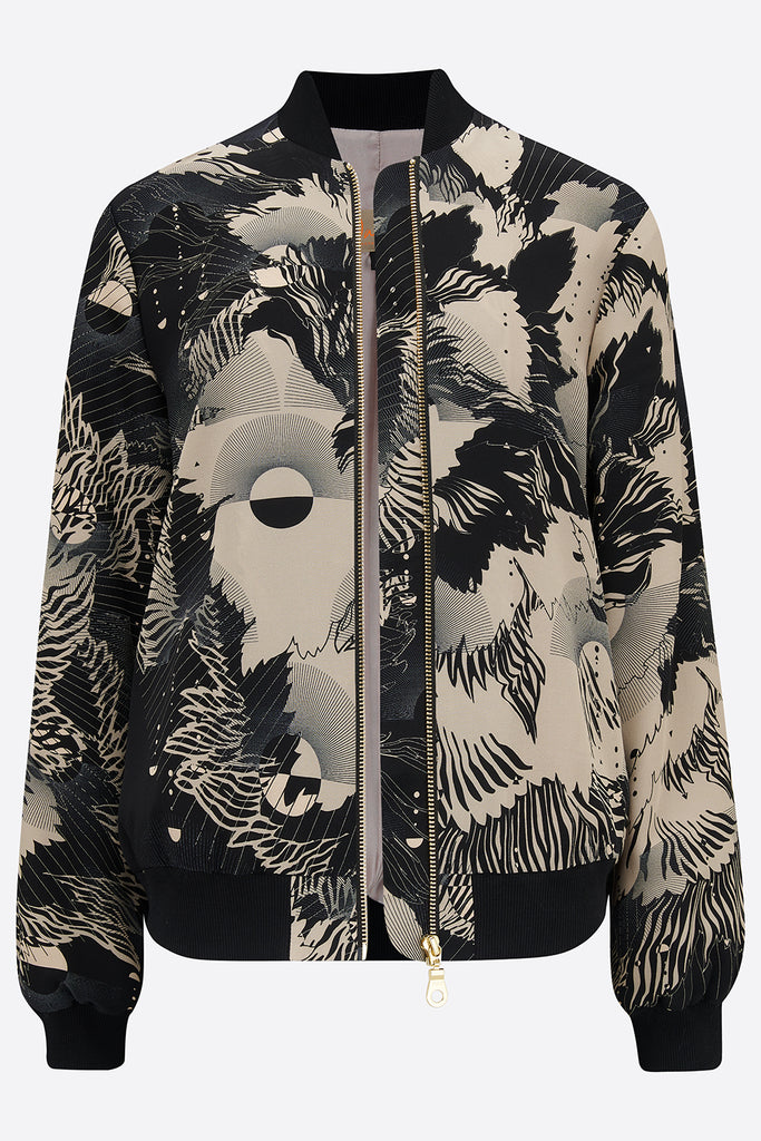 An unzipped printed silk bomber jacket in grey and cream geometric floral design
