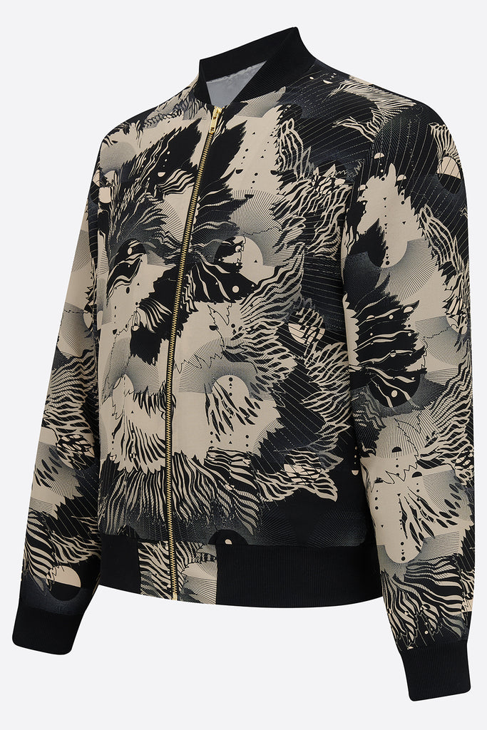 The side of a silk mens bomber jacker in a deep navy and cream print abstract floral print