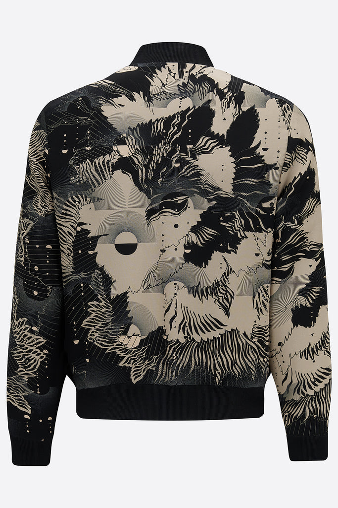 The back of a silk mens bomber jacker in a deep navy and cream print abstract floral print