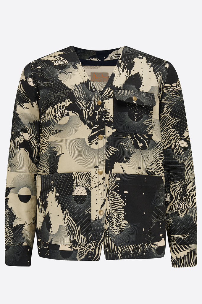 The front of a cotton mens utility jacket with a navy and cream abstract floral print