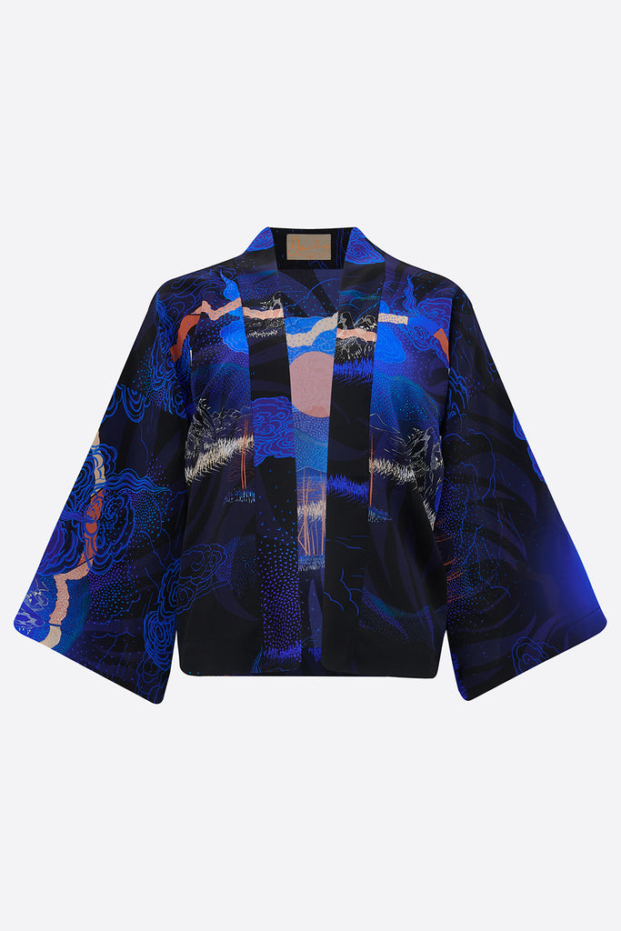 The front of a short Silk Kimono Jacket with Japanese landscapes in blues and pinks